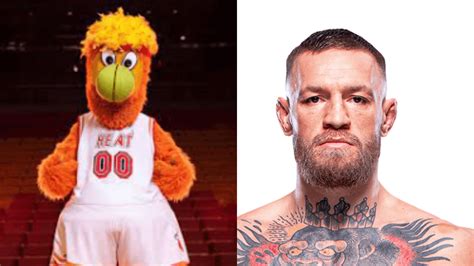 Mcgregor unleashing a punch on the mascot